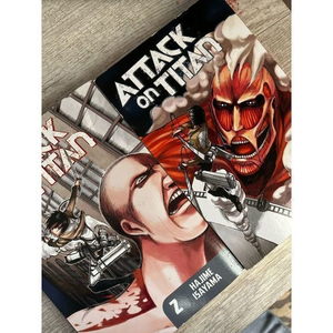 Attack on Titan volume one and two‎ books ￼anime ￼